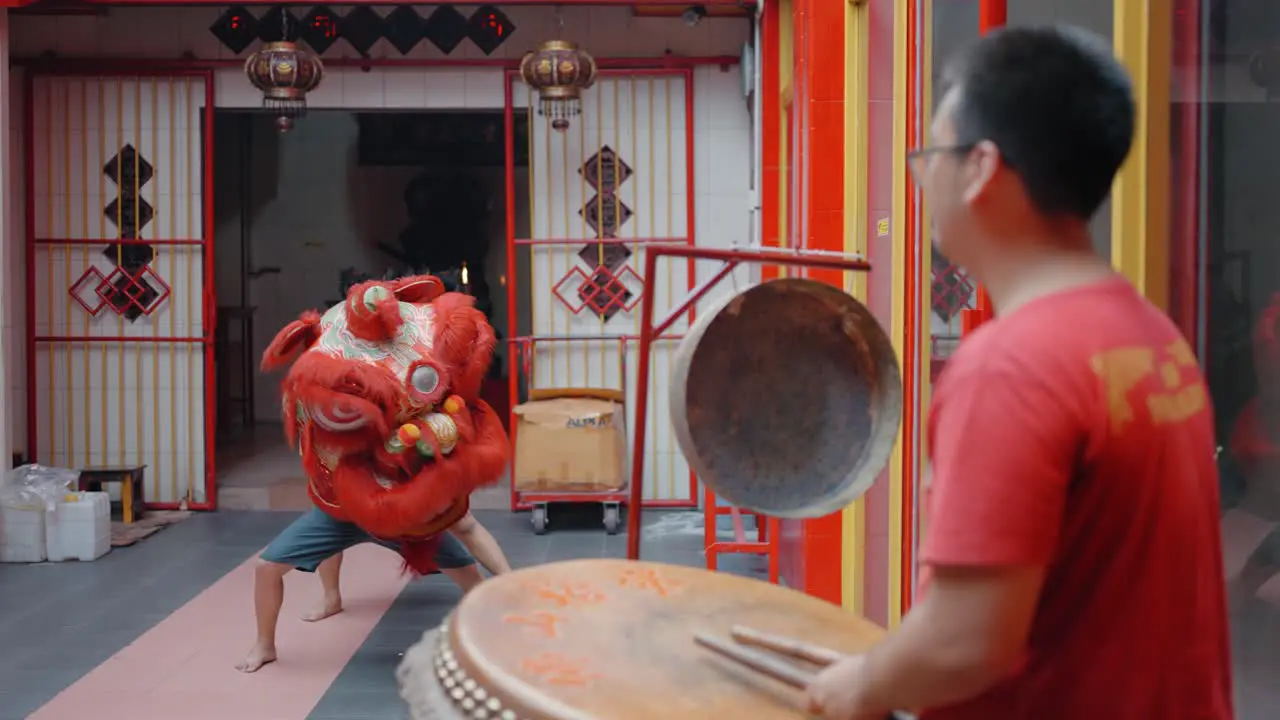 Tracking Shot of Boy Dancing as Dragon