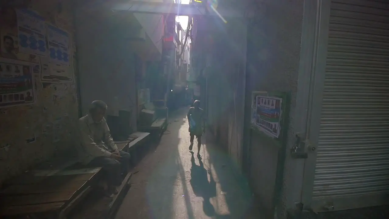 Elderly Man Walks Down Dark Alleyway