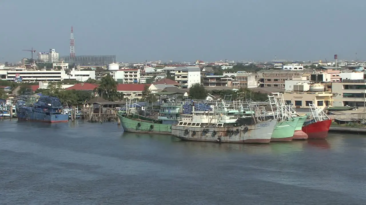 Fishing boats by the Chao Phraya River