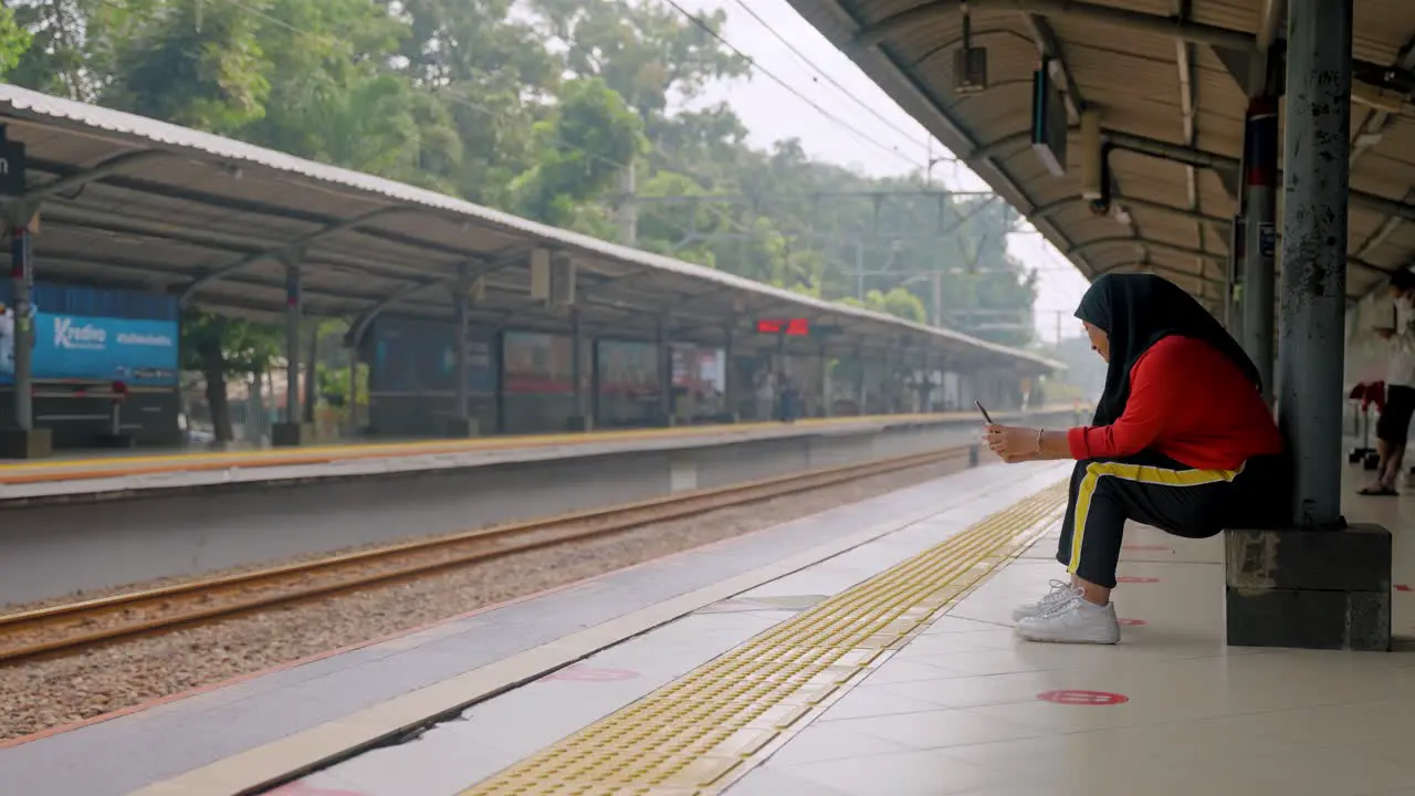 Wide Shot of Woman at Train Station in Jakarta