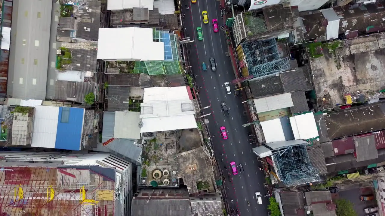 Aerial Shot of Bangkok Traffic and Tilting to Reveal Cityscape at Sunset Thailand