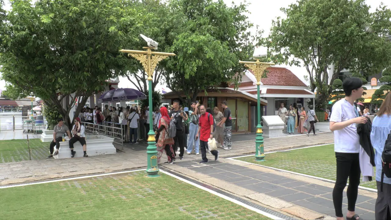 Crowded people travel iconic Landmark of Bangkok with Temple of Wat Arun in Bangkok