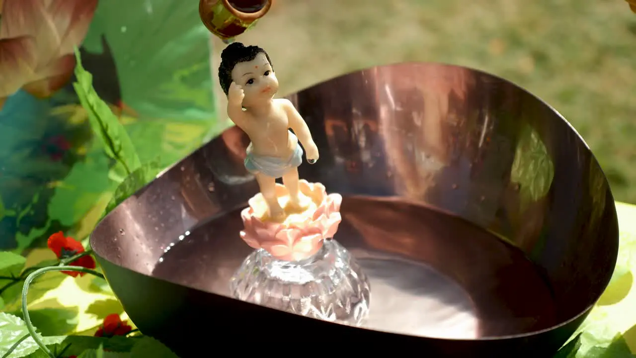 Water Being Poured Over A Buddha Statue