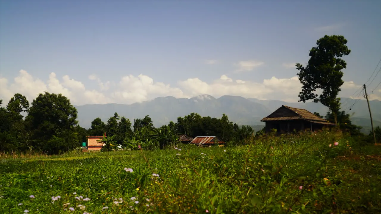 Timelapse of shadow of clouds moving over a green field in Nepal