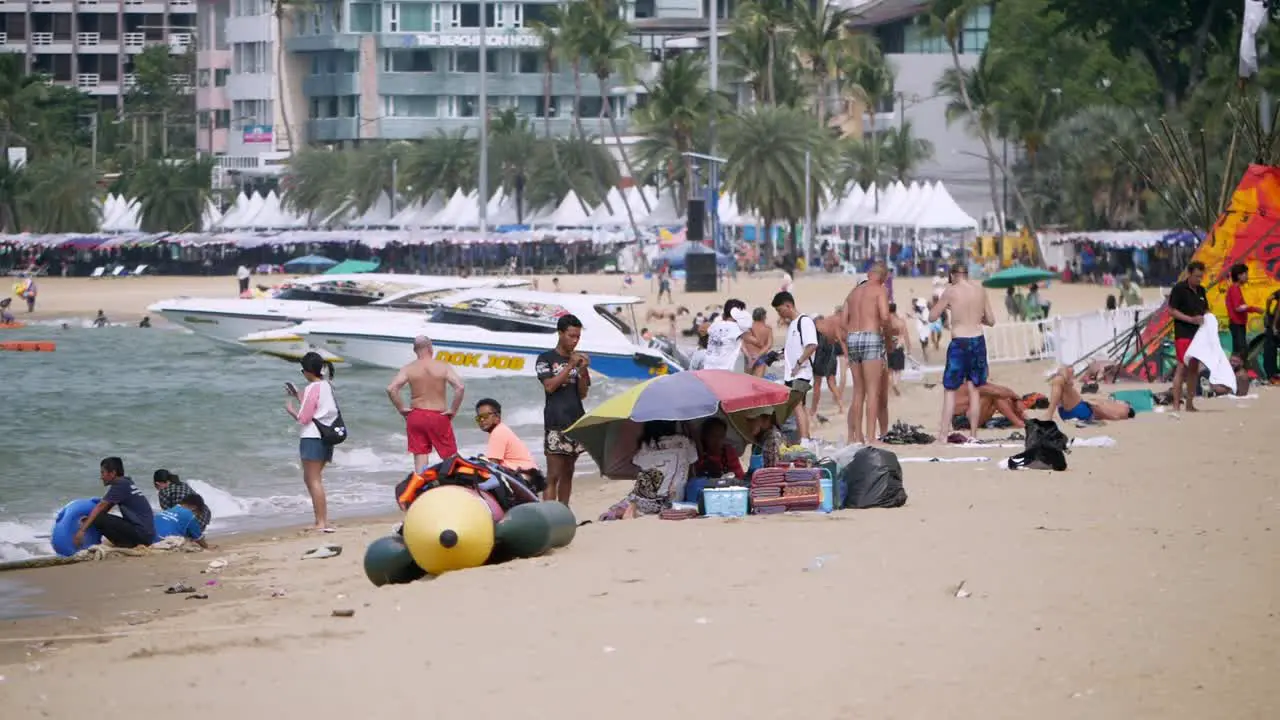 Local and foreign tourists flock at the beachfront of Pattaya in the province of Chonburi in the eastern part of Thailand