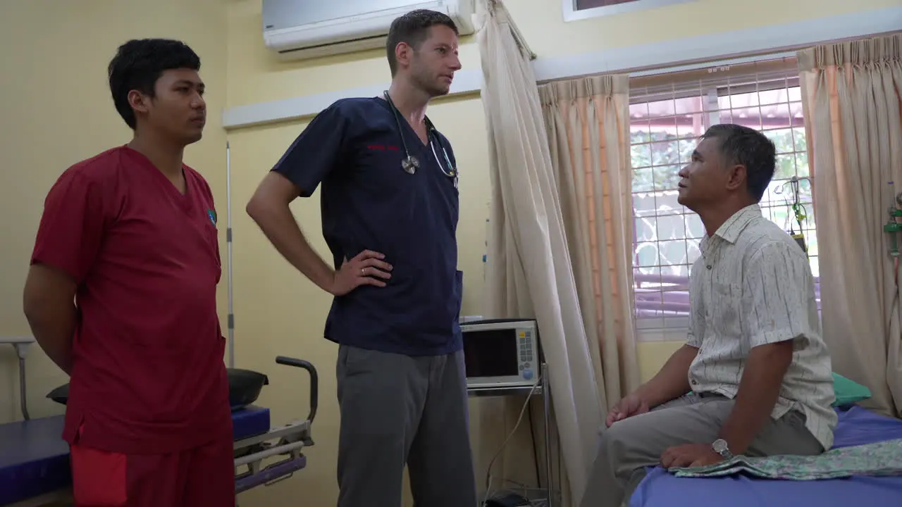 Doctor talking to Cambodian patient