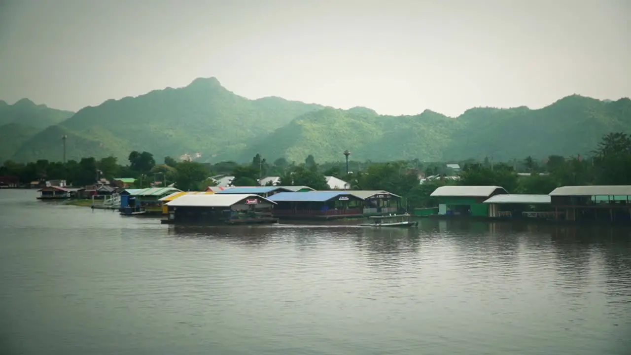 Boats and houses float on river in Asia