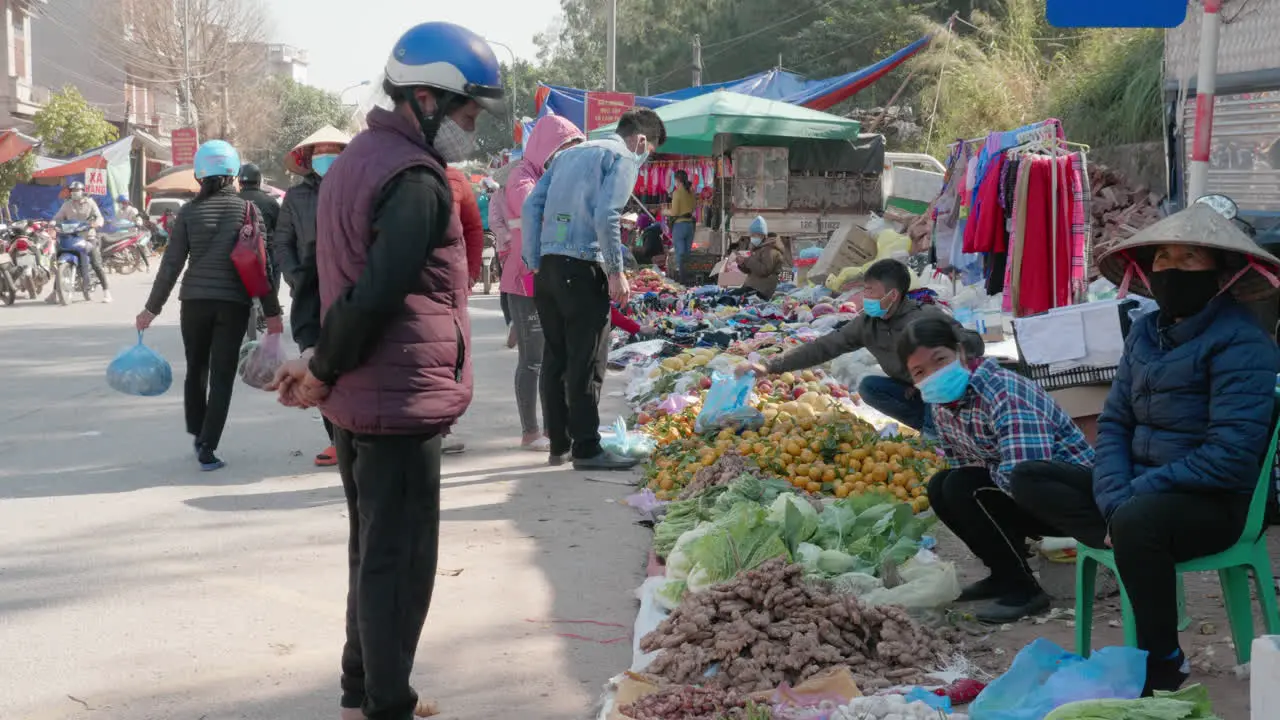 People using face mask in an open market during covid 19 pandemic in Asia