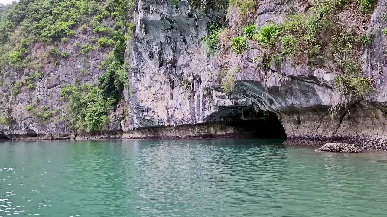 cliffs and cave on an island nestled within the stunning Halong Bay in Vietnam Asia