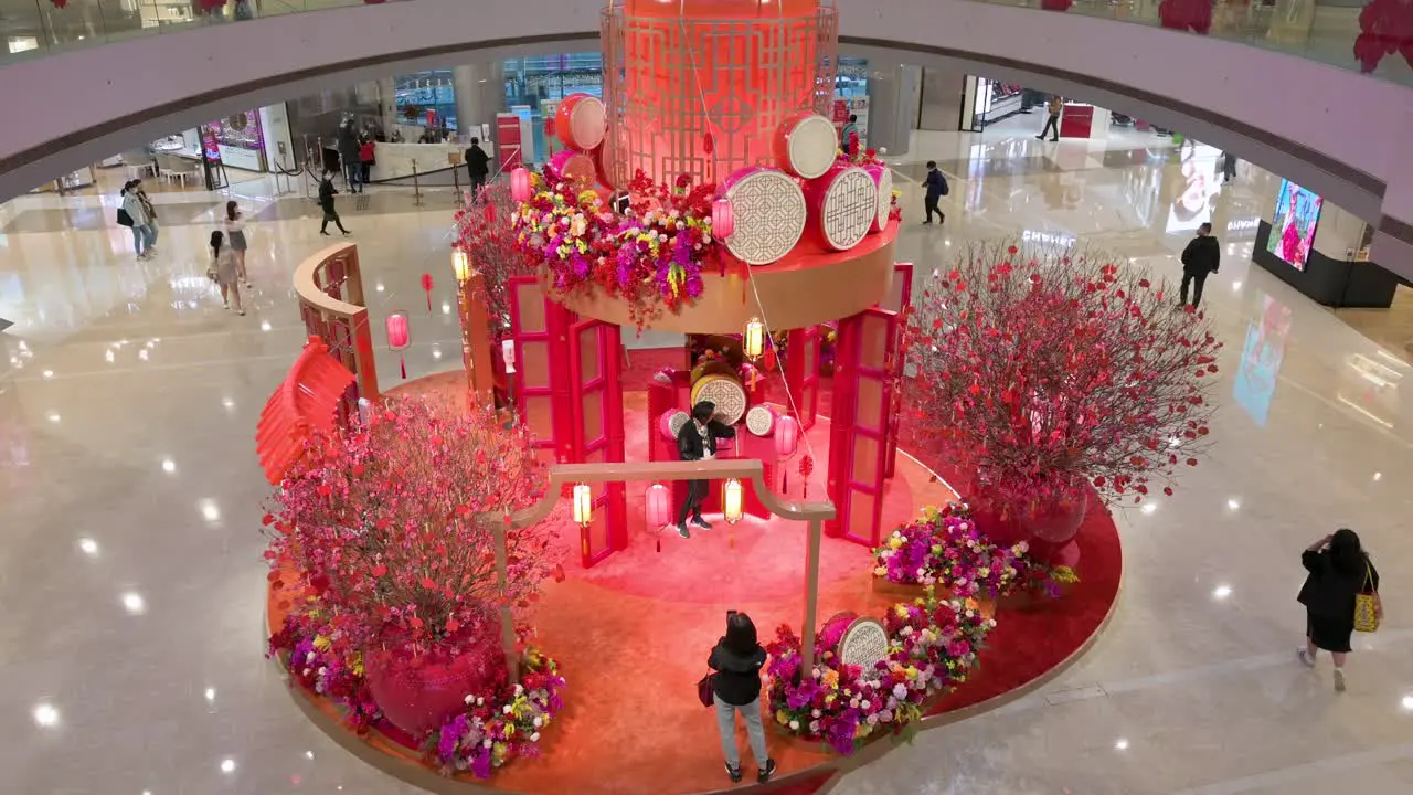 Chinese shoppers are seen at a Chinese New Year theme installation event for the Chinese Lunar New Year in Hong Kong