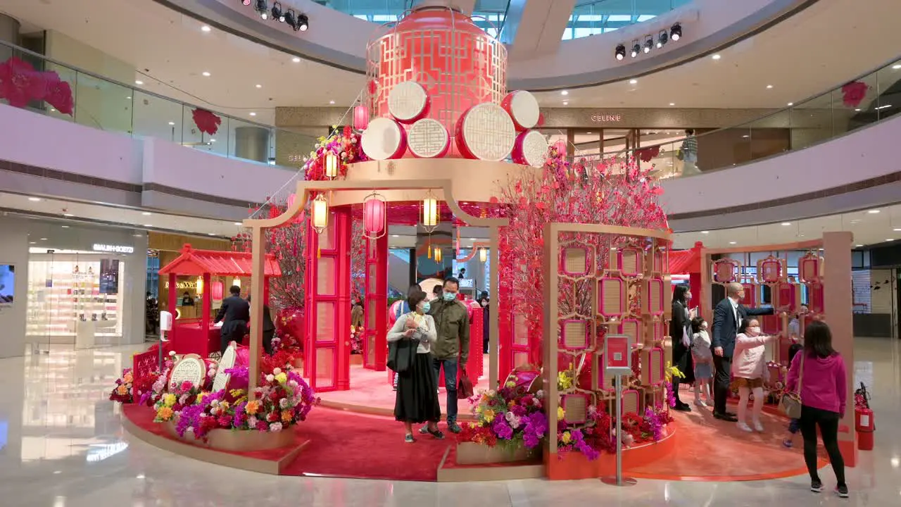 Chinese retail shoppers are seen at a Chinese New Year theme installation event for the Chinese Lunar New Year in Hong Kong