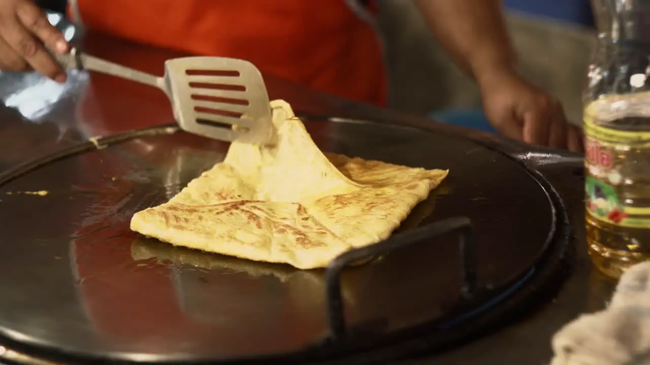 Preparation of tasty Thai Roti banana pancake