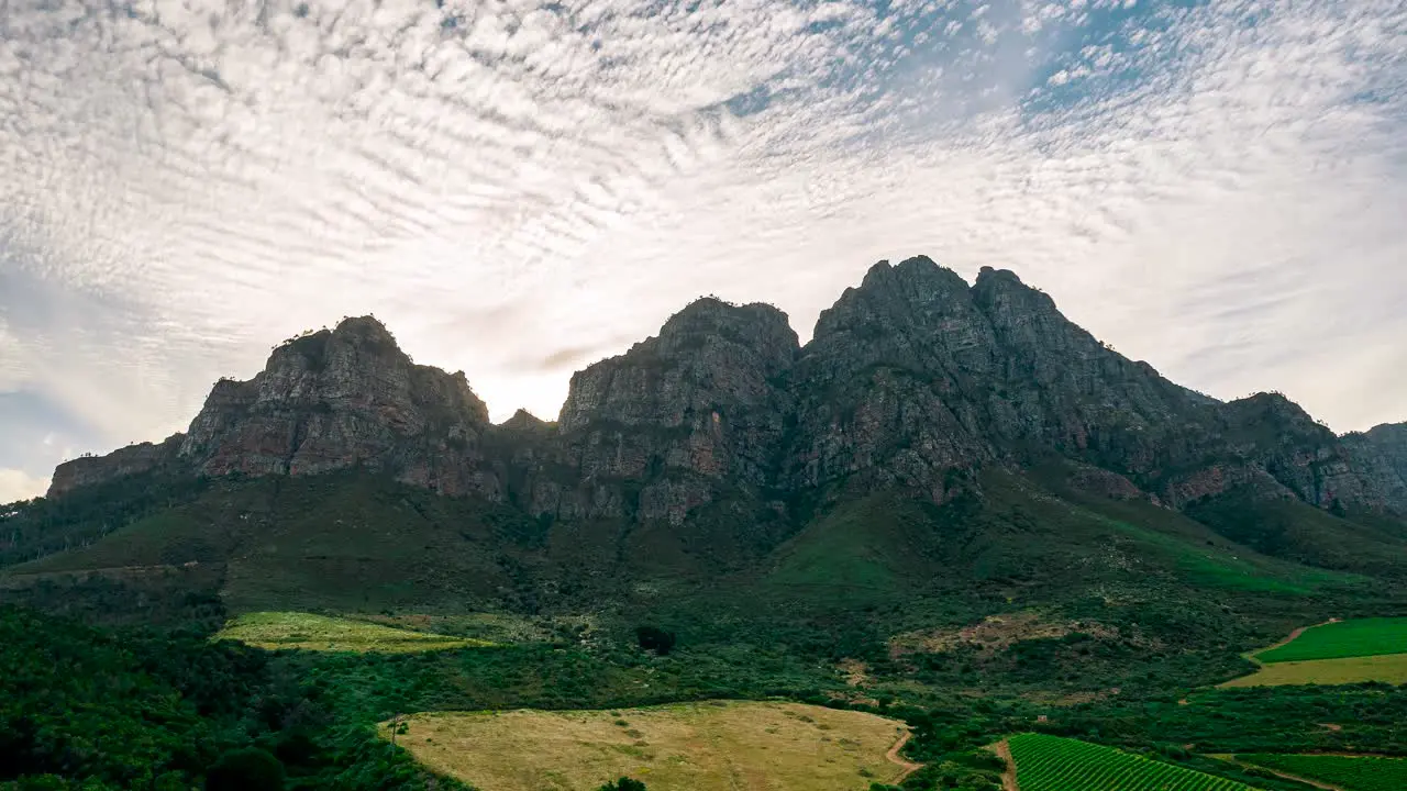 Embark on a visual journey through South Africa's majestic mountains with this stunning hyperlapse footage capturing the dynamic movement of clouds and the lush green landscapes