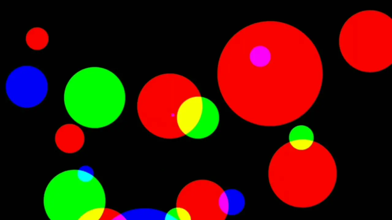 Computerized animation of colorful circles of various sizes flickering with various intensity on black background