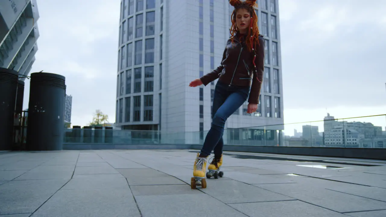 Focused roller skater riding outside Active woman training on rollerblades