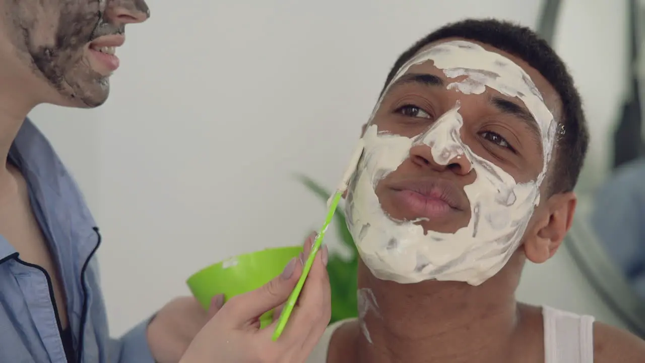 Portrait Of A Black Man Having Facial Mask Applied