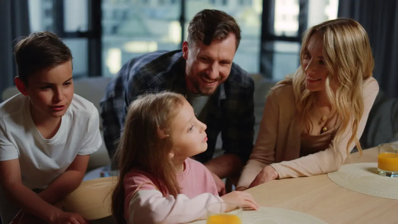 Cute family having video call at home Parents kids enjoying online conversation