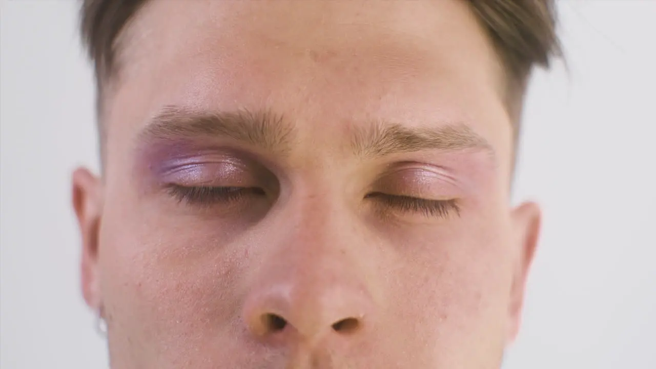 Close Up Of Blonde Guy With Blue Eyes Looking At Front