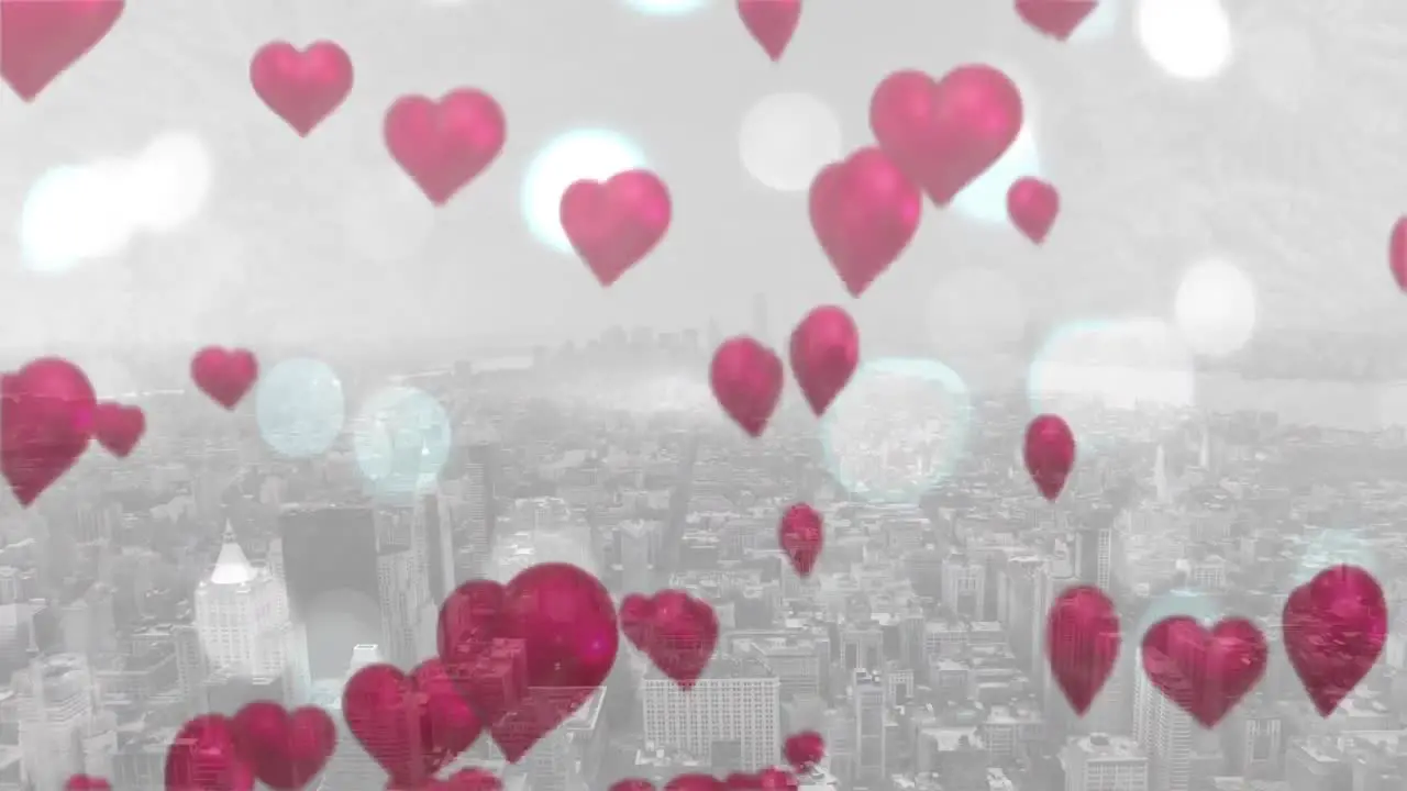 Floating heart balloons on a city