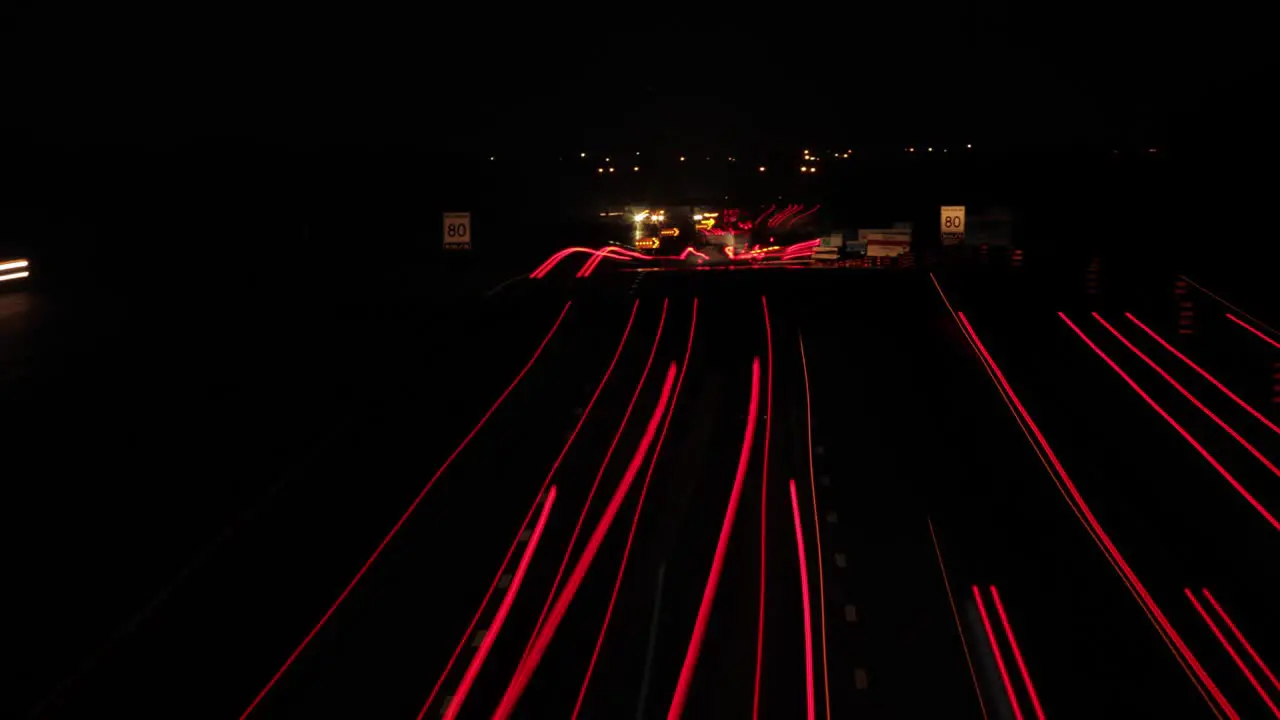 Night time time lapse of multi lane freeway with streaking lights