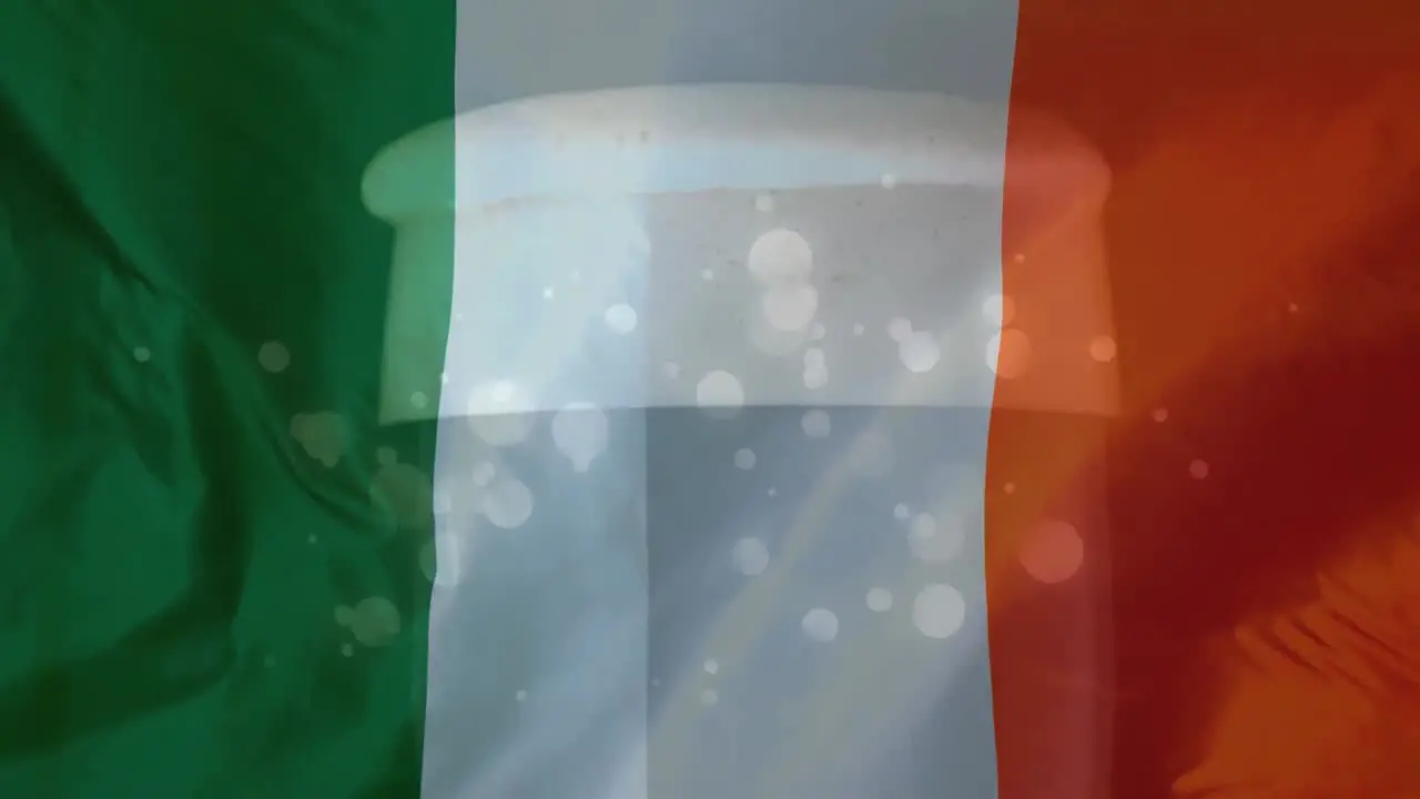 Irish flag with glass of beer and light effect on the background for St Patricks Day