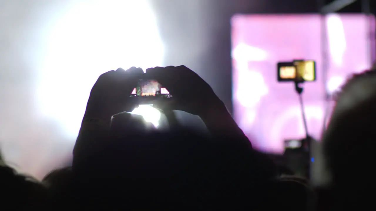 A happy crowd having a great time on a concert show