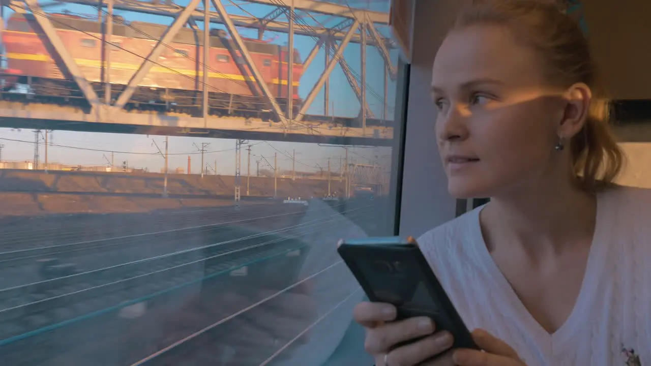 In Saint-Petersburg Russia in train rides young girl and looking out the window