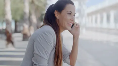 Relaxed young woman talking on her mobile