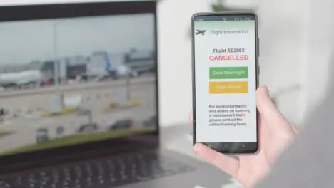 Person Mobile Phone Screen With Text Message Cancelling Holiday Flight