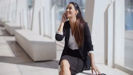 Young businesswoman talking on her smartphone