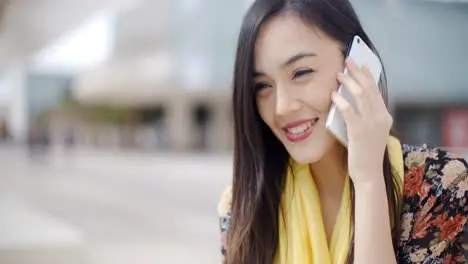 Smiling happy woman using a mobile phone