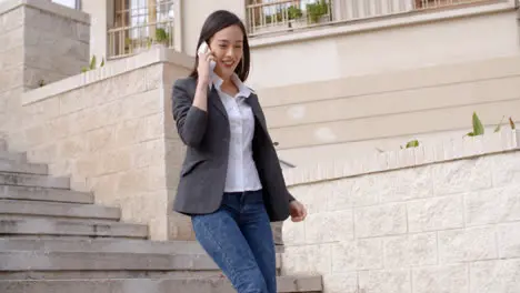 Young woman chatting on her mobile