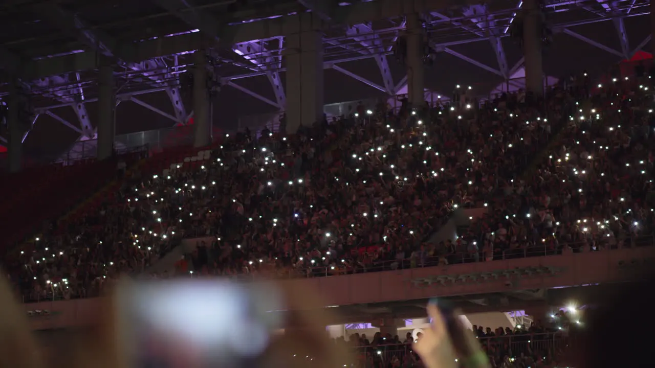 A beautiful view of crowded tribunes on a music concert