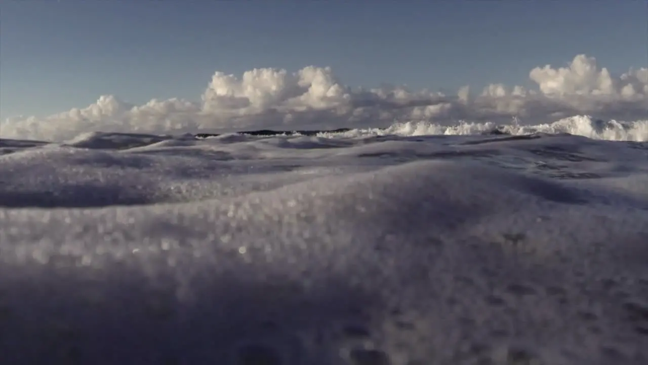 POV shot of waves crashing into shore including underwater perspective 1