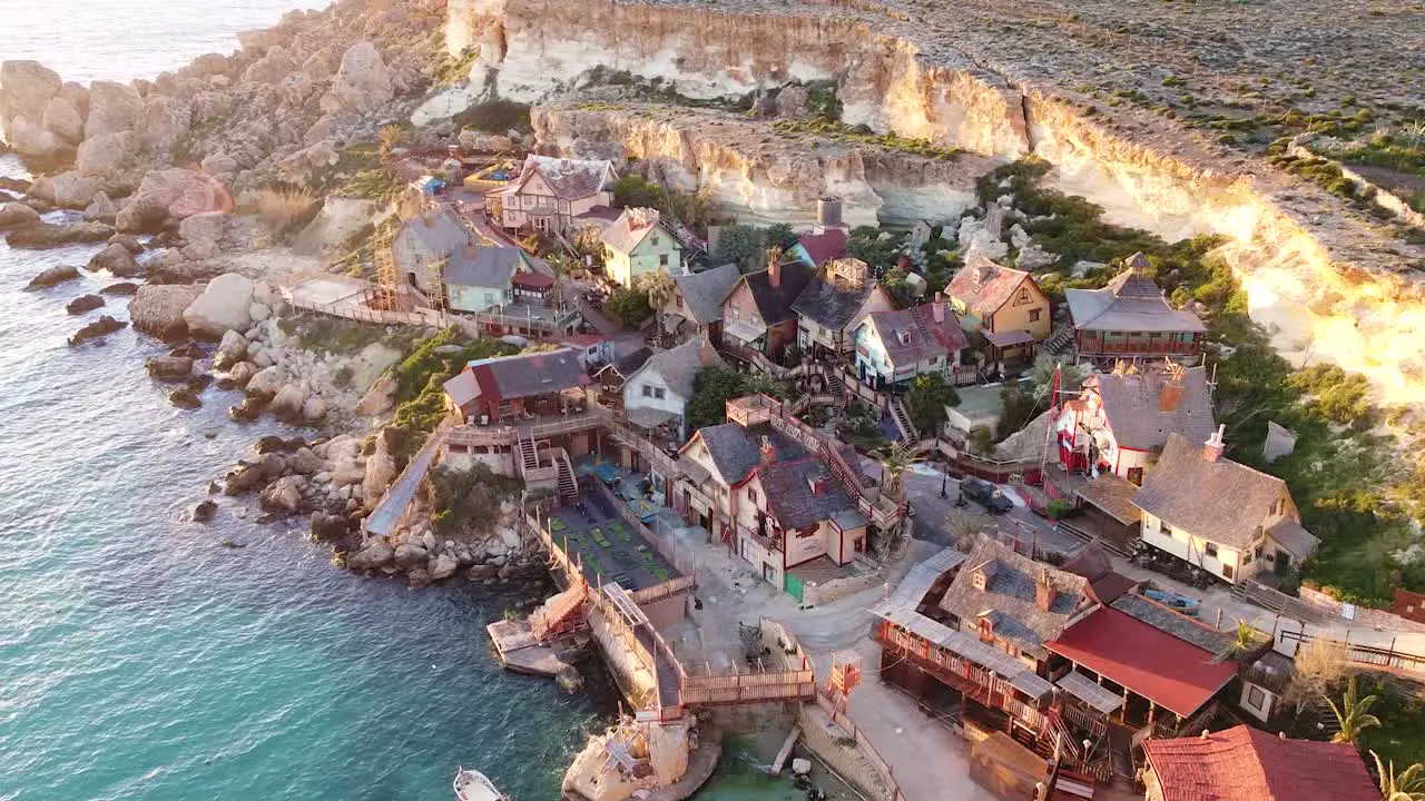 Wooden film set village of Popeye on Malta island coastline aerial drone view