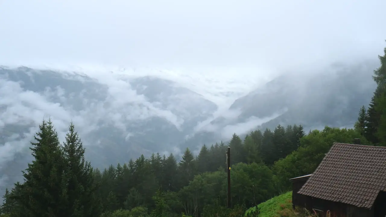 Amazing time-lapse of moving clouds over green valley