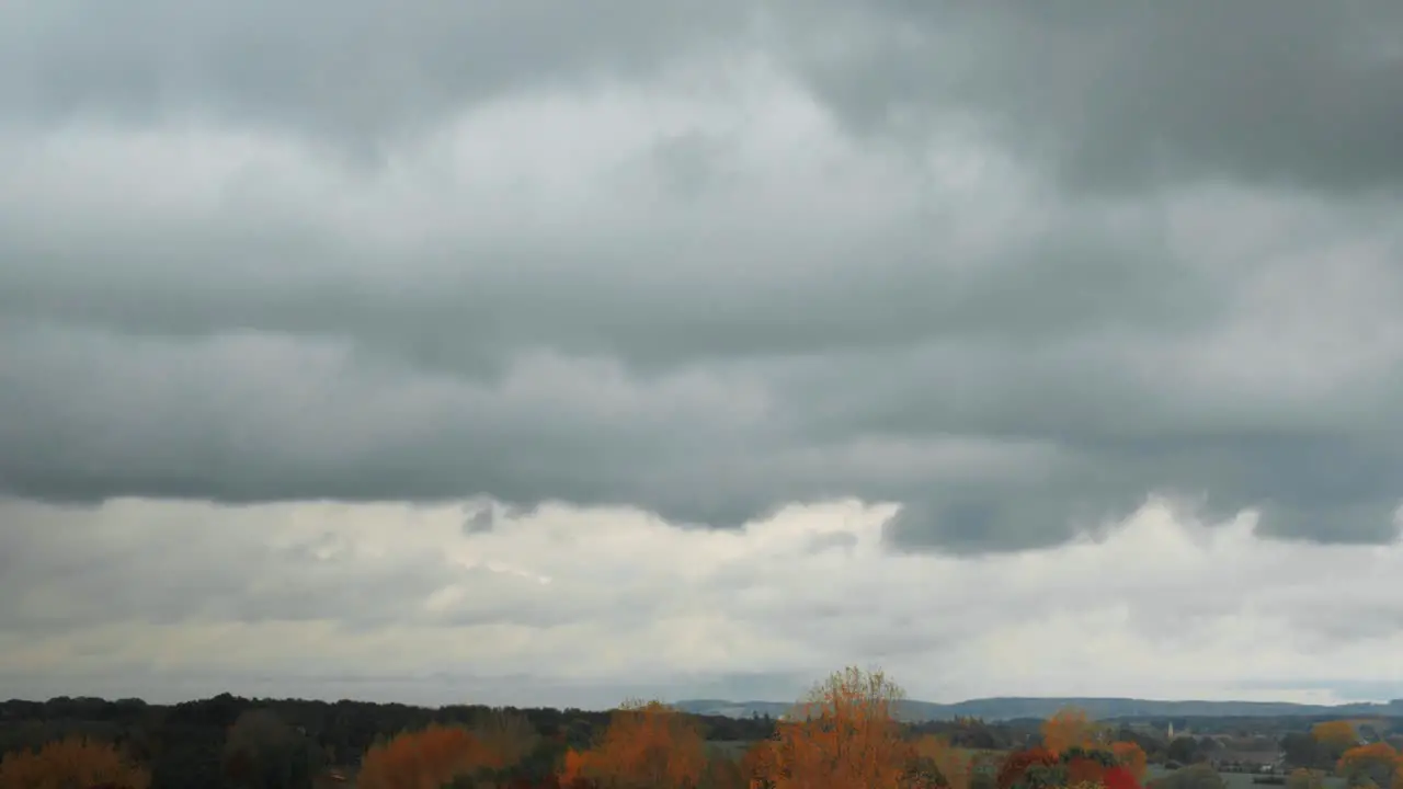 A time-lapse shot with moving clouds starting with a horizon shot that focuses more and more on the clouds