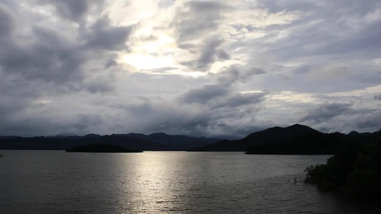 Panoramic Landscape Shot of Clouds and Sunlight Peering Through Over the Mountainous Range of Kaeng Krachan National Park in Thailand