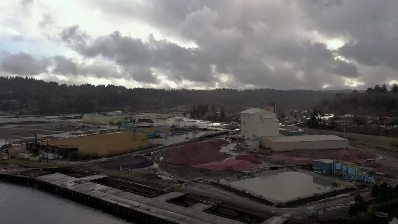 Aerial circling shot of mill company for wood and paper products