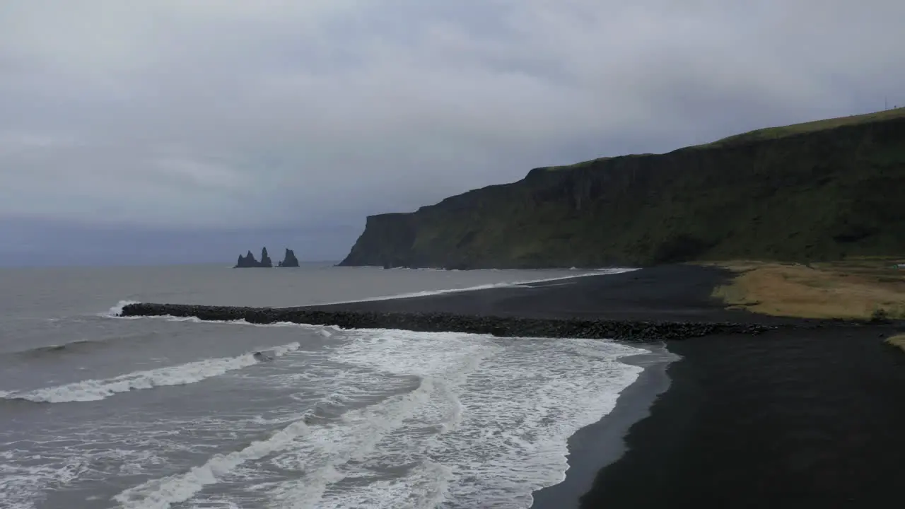 Aerial Panoramic shot of Reynisfjara black sand beach in the southern coast of Vik in Iceland