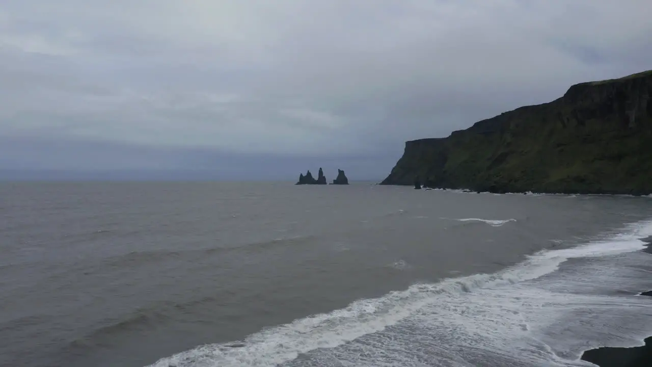 Drone panoramic shot of Reynisfjara black sand beach in the southern coast of Vik in Iceland