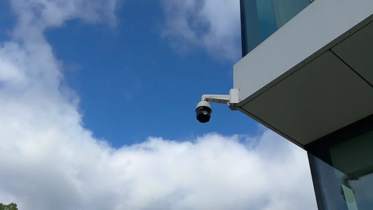 security camera against a cloudy sky