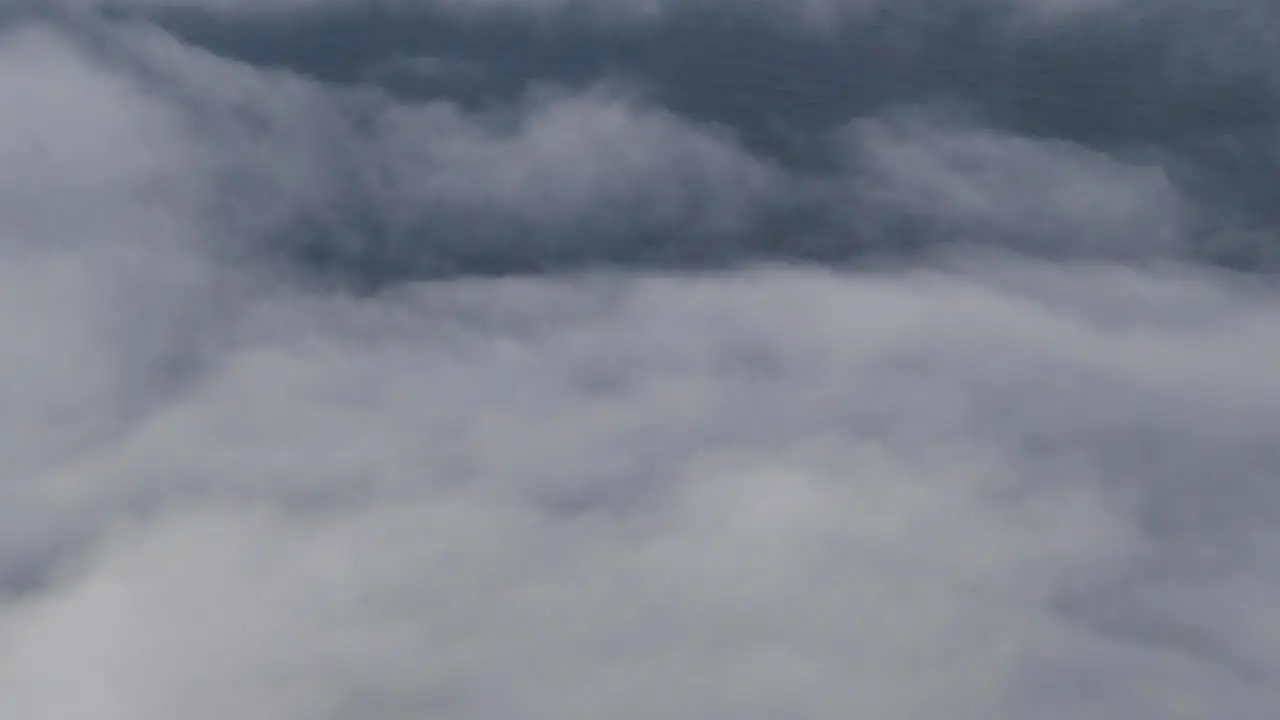 Clouds Moving By From Airplane Window