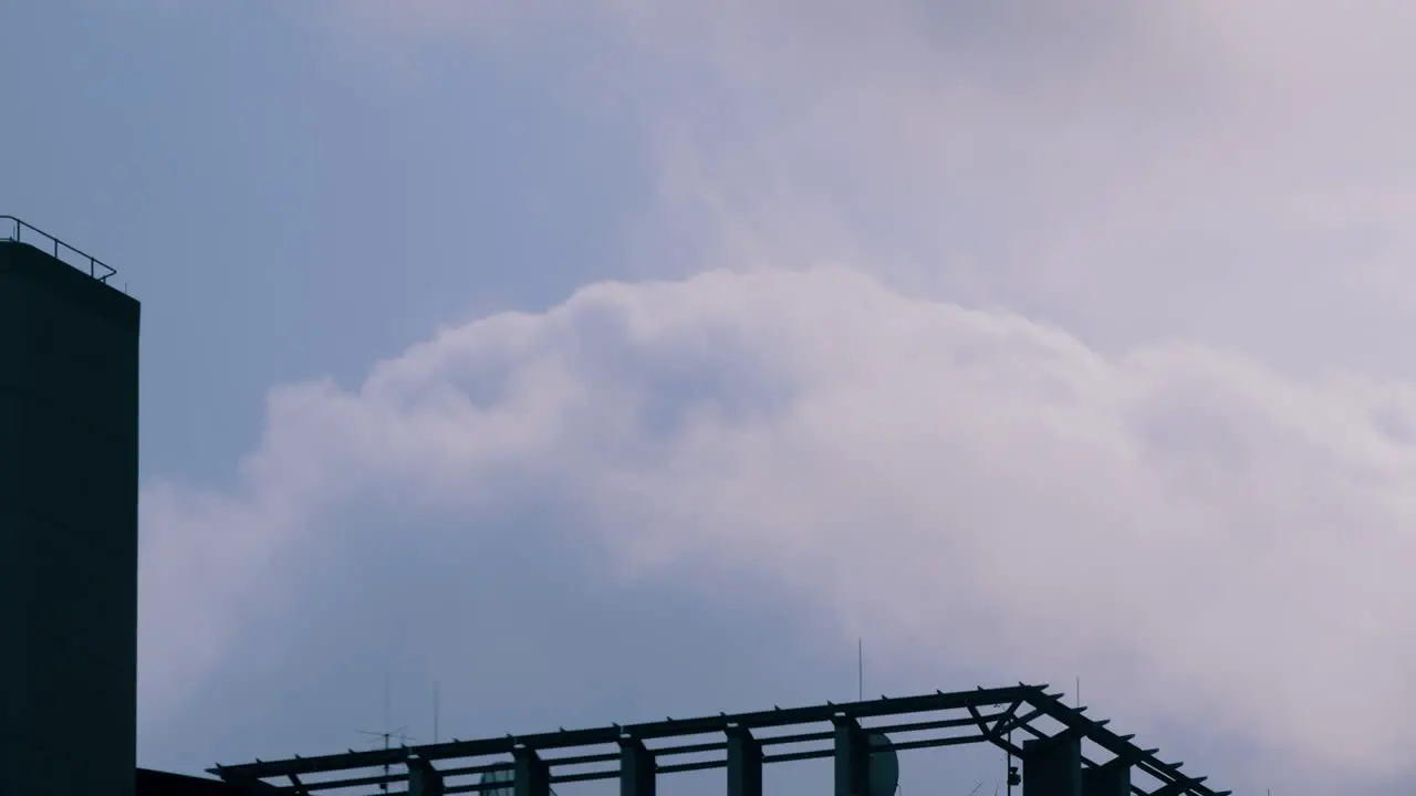 Looking On Cloudscape Over Structures During Sunny Day