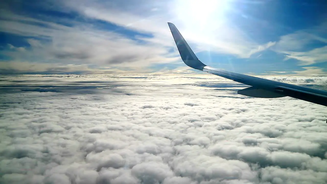 commercial airplane cross over heavenly clouds sky