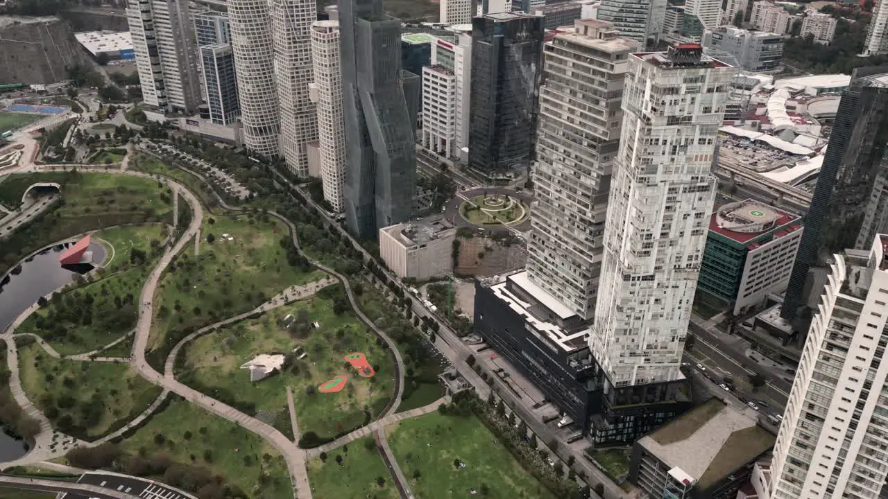 Drone hyperlapse video of Santa Fe in Mexico City large buildings avenues and La Mexicana Park