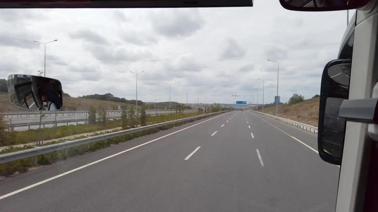 On a cloudy day a shot from a bus traveling towards Istanbul Airport