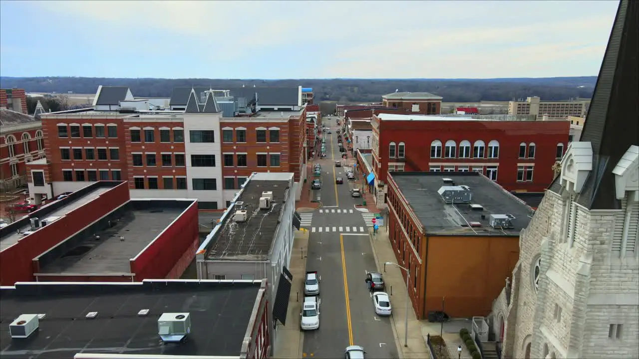 Low drone shot Flying down a downtown city street in Clarksville Tennessee