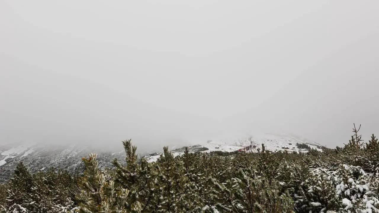 Cloudy mountain peak timelapse people on a trail mount Sniezka  Poland