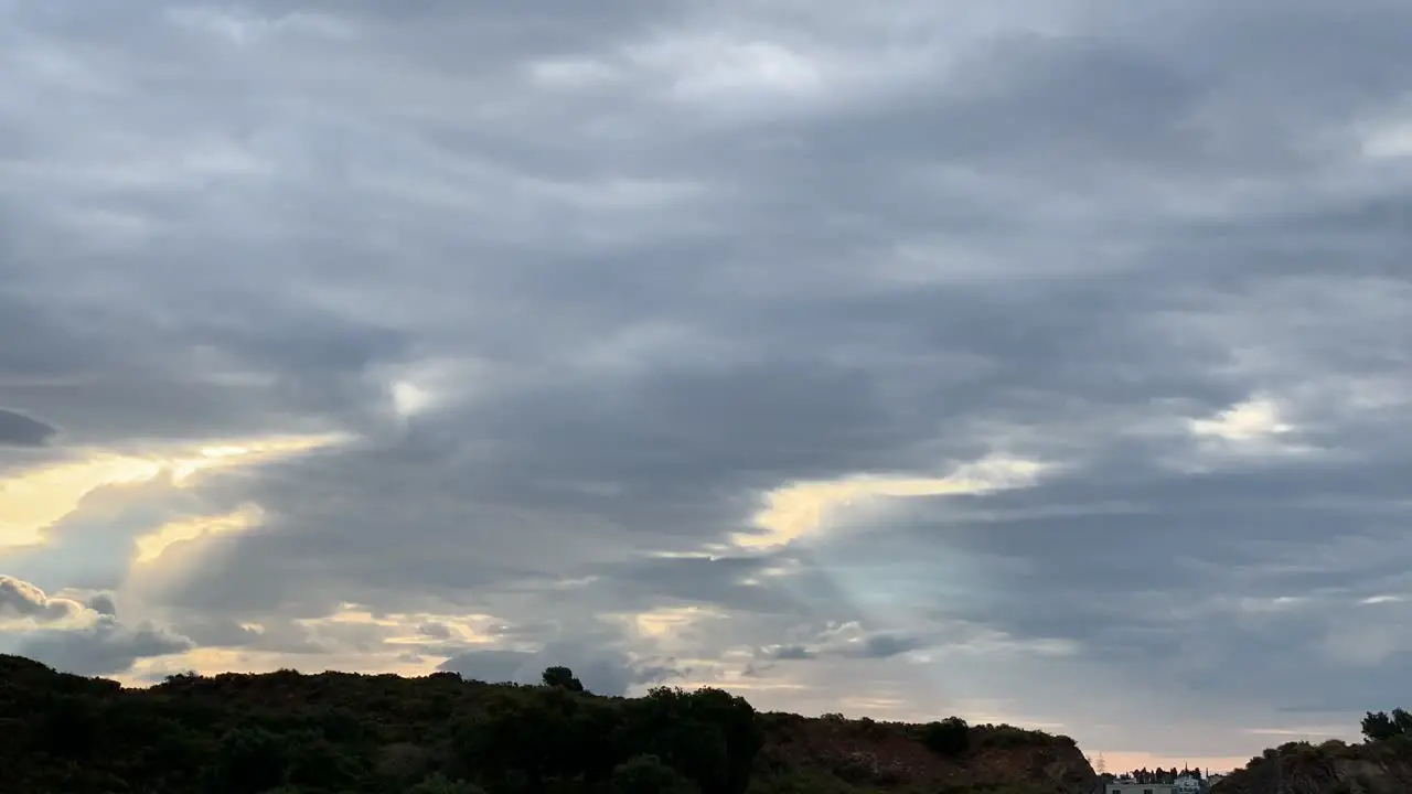 beautiful sunrise behind the clouds time lapse showing the passing of time or a new day